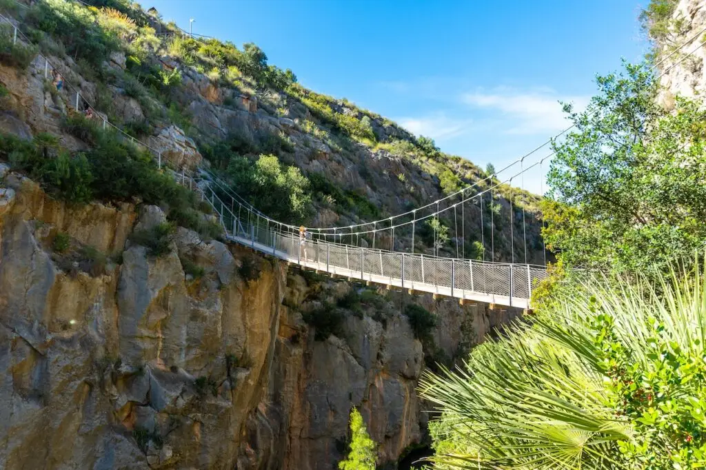 Image of a bridge for a day trip activity from Valencia. View of gorgeous Chulilla Suspension Bridge in Valencia