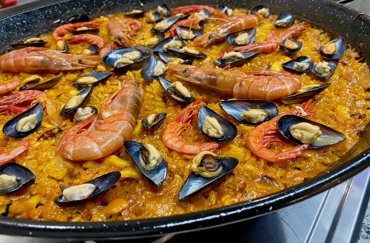 Homemade paella from the cooking class we took in Valencia showcasing fresh seafood from the local marekt