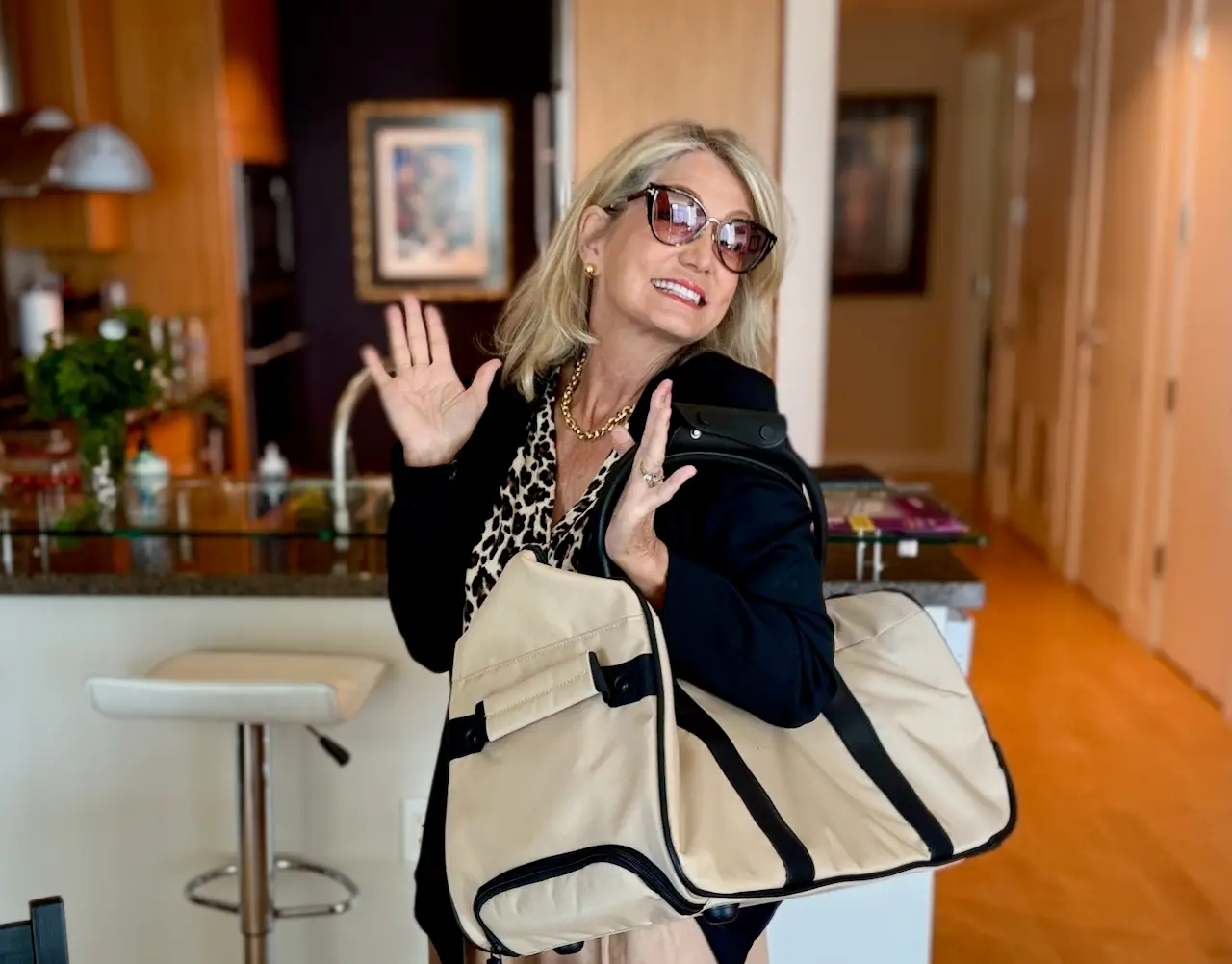 Picture a me, a woman smiling with her new dufel bag