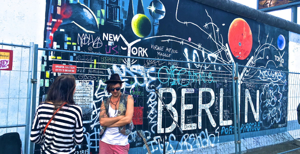 man near the Berlin wall